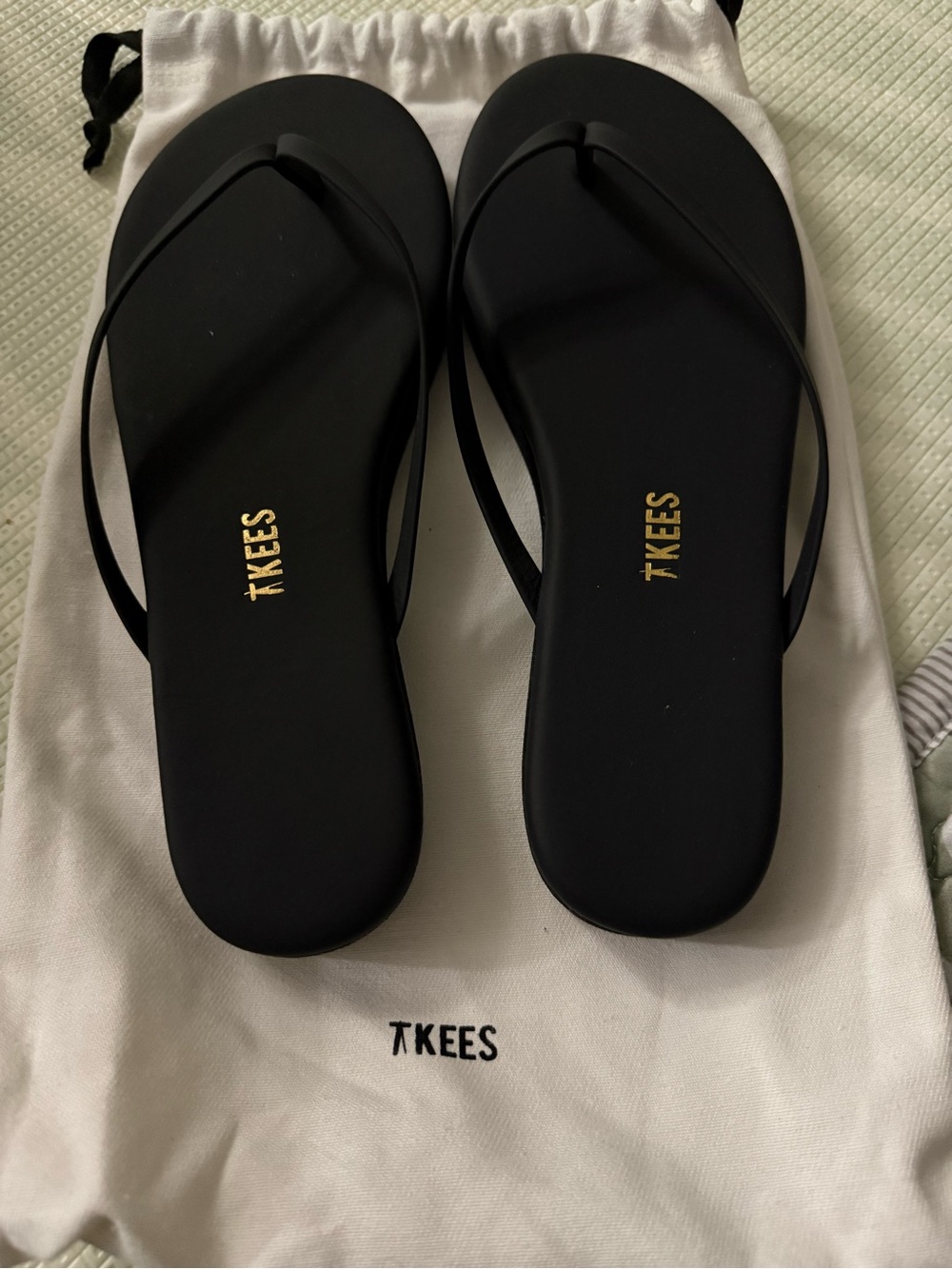 TKEES Black Slim Strap Flip Sandals with Gold Logo